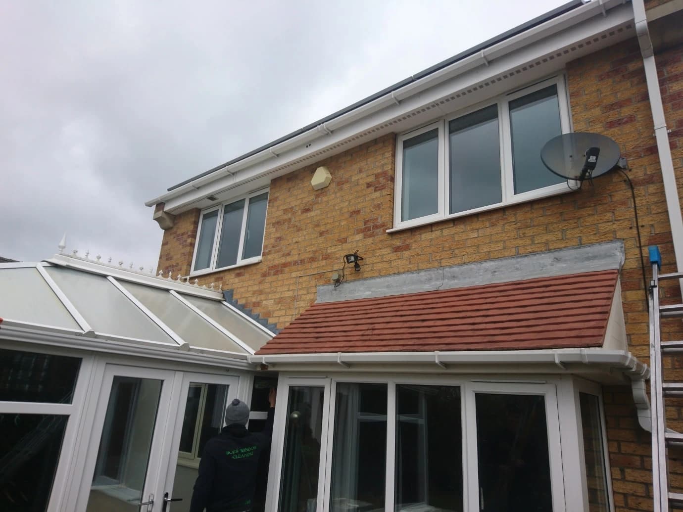 Terracotta clay roof tiles repaired and replaced on a house extension in Liverpool